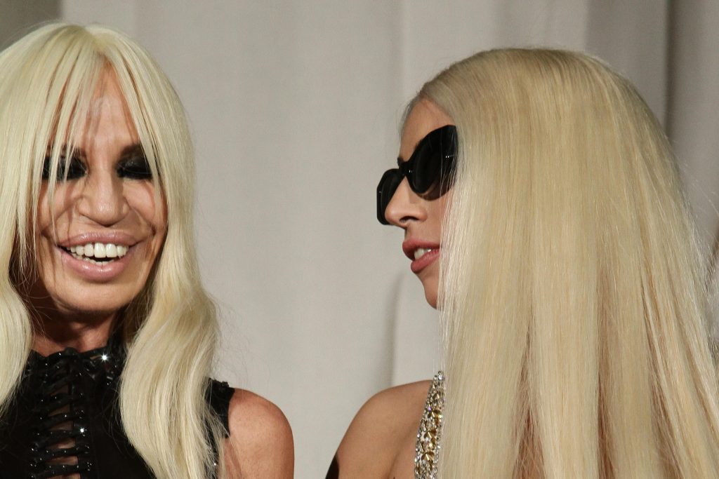 Lady Gaga And Donatella Versace Throw Roses To Their Fans In Milan